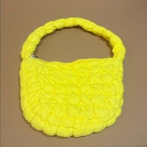 neon yellow shoulder bag with puffy quilted design